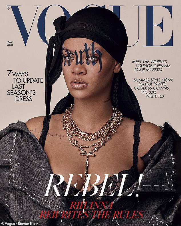 Rihanna on the cover of British Vogue with a tattoo across her face