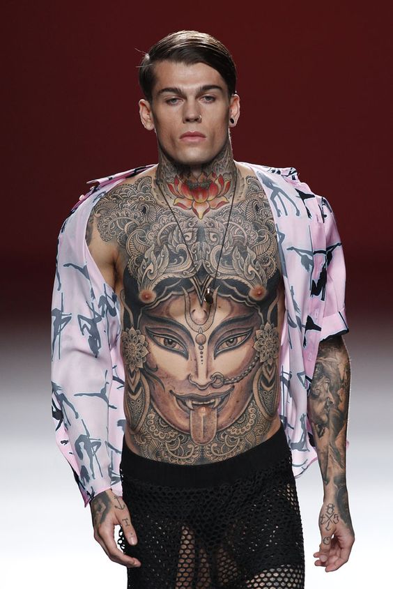 clothing model with many tattoos