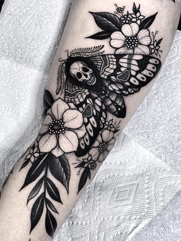blackwork tattoo style moth