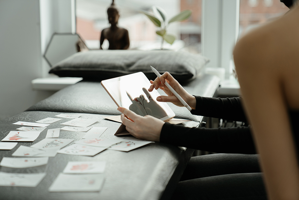 tattoo artist consulting with a client in a tattoo parlor