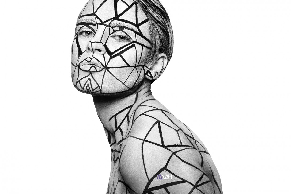 Model with temporary tattoo lines across her body and face