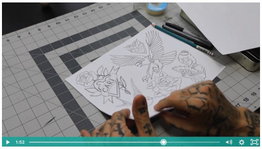 professional tattoo artist showing how to develop a tattoo design