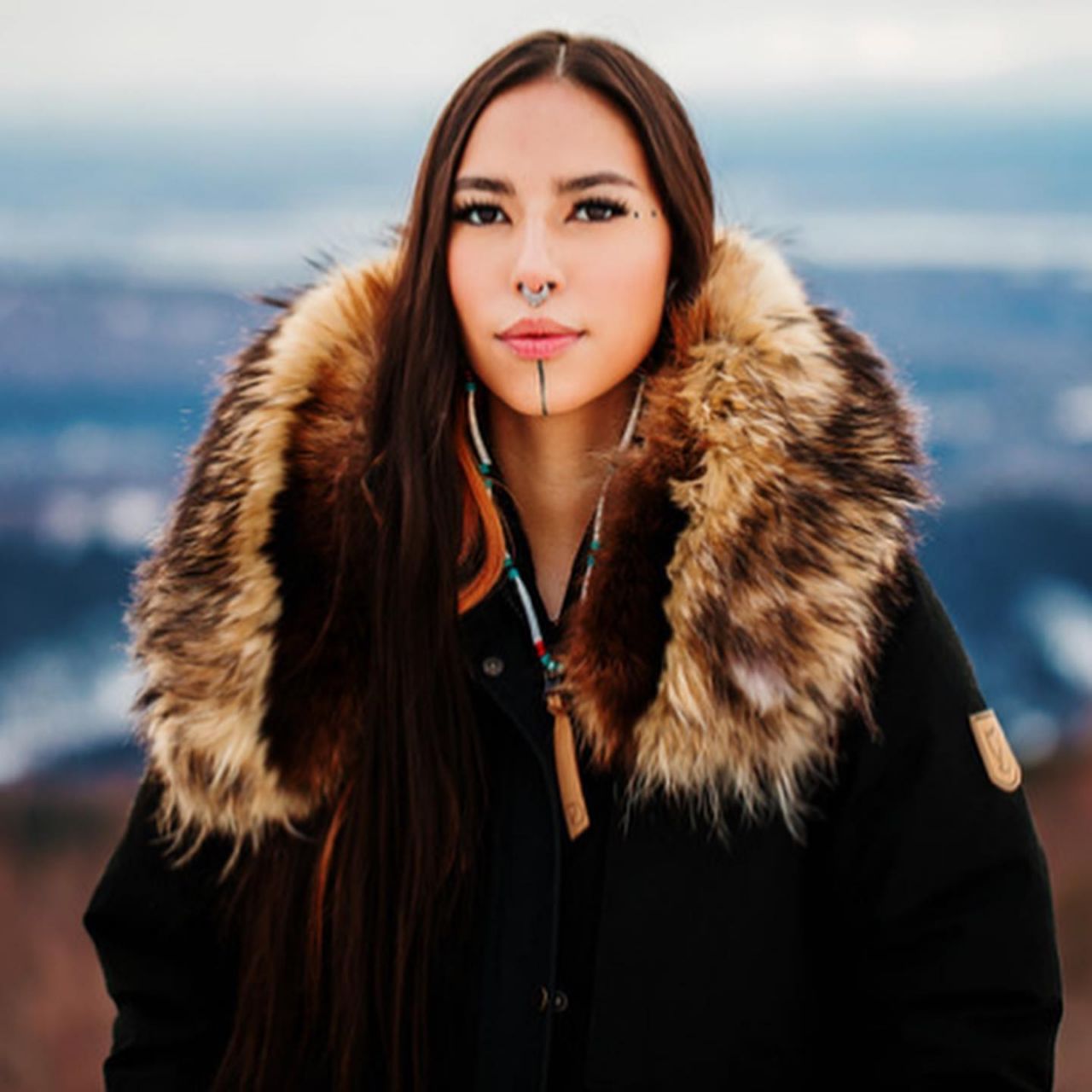 Model Quannah Chasinghorse pictured with her face tattoo