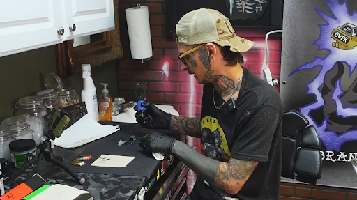 tattoo artist working in a tattoo shop