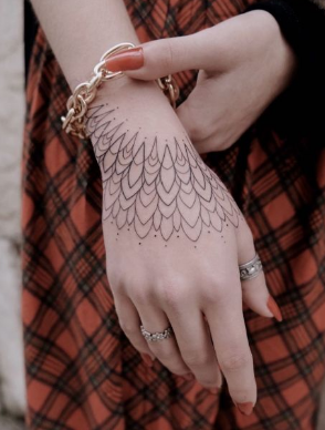 Delicate lined hand tattoo 