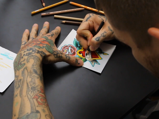 tattoo artist drawing American Traditional tattoo art