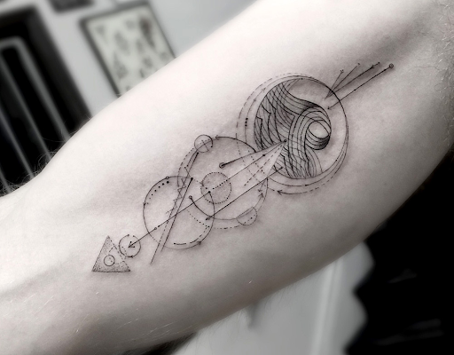 Fine line geometric shapes forearm tattoo
