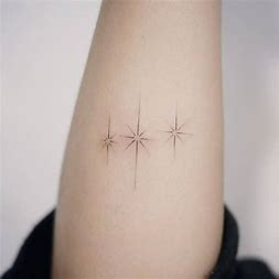 Fine line tiny tattoos of stars 