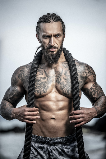 Fitness model with tattoo sleeves 