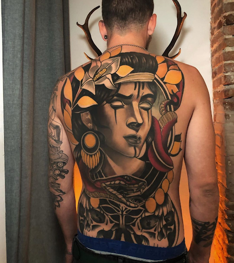 person with body covered in tattoos