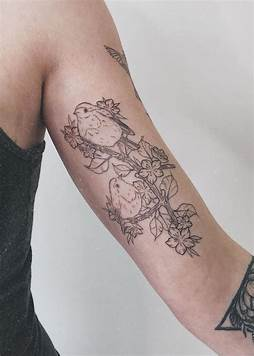 Inner bicep bird tattoo made with very fine lines