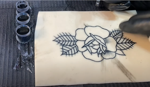 tattoo needles and black ink 