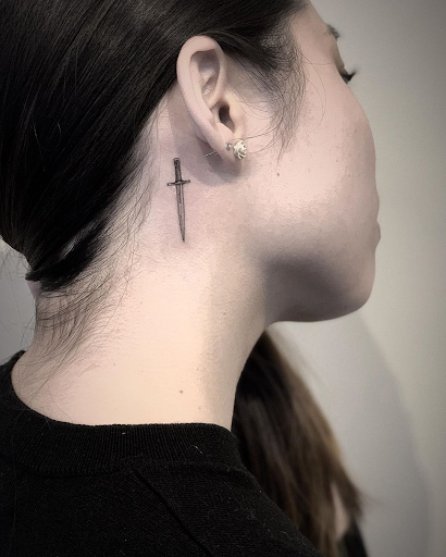 ear and neck tattoo