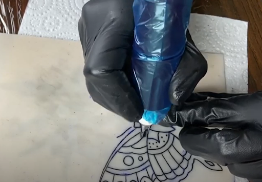 rotary tattoo machine tattooing at its max operating voltage