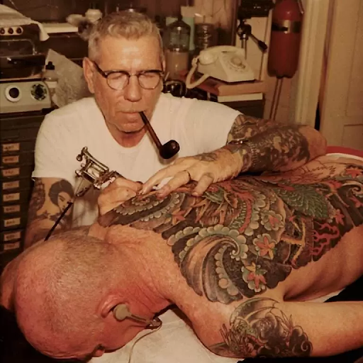 Sailor Jerry working in a tattoo shop