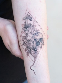 Skull and flowers fine line tattoo in black ink
