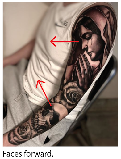 upper arm tattoo of a woman